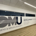 Large wall depicting the learning environment at Owens & Minor Corporate Headquarters
