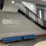 Owens & Minor Corporate Headquarters four-floor open stairwell wall design